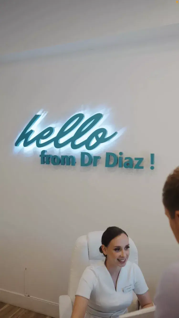 Friendly dentist in Jupiter, Florida performing routine dental checkup